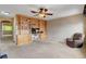 Bedroom featuring built-in shelving and cabinets, ceiling fan, and neutral carpet at 950 Eagle Mountain Dr, Las Vegas, NV 89123
