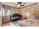 Cozy bedroom featuring rainbow decor and hardwood floors at 950 Eagle Mountain Dr, Las Vegas, NV 89123