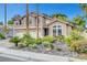 Inviting two-story home featuring lush landscaping and a spacious three-car garage at 950 Eagle Mountain Dr, Las Vegas, NV 89123