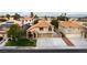 Beautiful home features a tile roof and a well-maintained lawn, complemented by a three-car driveway at 9843 Frosty Canyon Ct, Las Vegas, NV 89183