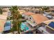 An aerial view of a backyard pool area, a covered patio, and tropical landscaping in a residential neighborhood at 9843 Frosty Canyon Ct, Las Vegas, NV 89183