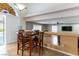 Cozy dining area with view to pool, shutters and tile floors at 9843 Frosty Canyon Ct, Las Vegas, NV 89183