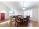 Open dining room features hardwood floors, modern lighting, and seamless access to the living area at 9843 Frosty Canyon Ct, Las Vegas, NV 89183