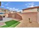 Spacious backyard with a brick retaining wall, providing a private and serene outdoor space at , Las Vegas, NV 89139