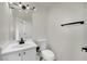 Clean and simple bathroom with white vanity, toilet, and updated fixtures at , Las Vegas, NV 89139