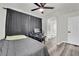 Comfortable bedroom with gray vinyl flooring, ceiling fan, and connected bathroom at , Las Vegas, NV 89139