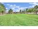 Expansive green space with manicured lawns, mature trees, and neighborhood homes in the background at , Las Vegas, NV 89139