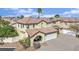 Two-story home with a terracotta tile roof, covered front porch, and attached two-car garage at , Las Vegas, NV 89139