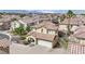 Two-story home with a terracotta tile roof, covered front porch, and attached two-car garage at , Las Vegas, NV 89139