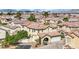 Two-story home with a terracotta tile roof, well-manicured yard, and an attached two-car garage at , Las Vegas, NV 89139
