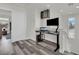 Bright home office featuring a black desk, mounted monitor, and stylish decor; perfect for remote work at , Las Vegas, NV 89139