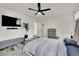 Well-lit main bedroom with a gray upholstered headboard, modern furnishings, and wood-look floors at , Las Vegas, NV 89139