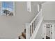Staircase leading upstairs with white banister and new vinyl flooring on the stairs at , Las Vegas, NV 89139