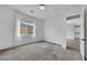 Bright bedroom with neutral carpet, white walls, and lots of natural light at 10161 Ocher Valley Ave, Las Vegas, NV 89178