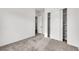 This bedroom boasts soft carpet, closet with sliding doors and a doorway to another room at 10161 Ocher Valley Ave, Las Vegas, NV 89178