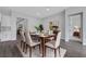 This dining room features modern decor, light-colored floors, and an abundance of natural light at 10161 Ocher Valley Ave, Las Vegas, NV 89178