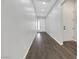 Bright hallway with wood floors, white walls, and neutral-toned trim at 10161 Ocher Valley Ave, Las Vegas, NV 89178