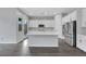 This modern kitchen boasts stainless steel appliances, an island, and bright white cabinets at 10161 Ocher Valley Ave, Las Vegas, NV 89178
