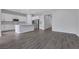 The open kitchen features stainless steel appliances, an island and bright white cabinets at 10161 Ocher Valley Ave, Las Vegas, NV 89178