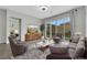 Comfortable living room with stylish furniture, an area rug and sliding glass doors to the backyard at 10161 Ocher Valley Ave, Las Vegas, NV 89178