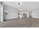 Open-concept living space with hardwood floors, recessed lighting, and seamless flow to the kitchen at 10161 Ocher Valley Ave, Las Vegas, NV 89178