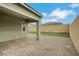 A covered patio features brick pavers and low-maintenance artificial turf at 10161 Ocher Valley Ave, Las Vegas, NV 89178