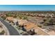Community aerial view showcasing the tile roofs, lush landscaping, and nearby golf course at 10537 Shoalhaven Dr, Las Vegas, NV 89134