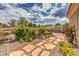 Beautifully landscaped backyard with desert landscaping and a stone walkway at 10537 Shoalhaven Dr, Las Vegas, NV 89134