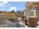Seating area in the backyard of a home with desert landscaping and mountain views at 10537 Shoalhaven Dr, Las Vegas, NV 89134