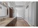 Bathroom showcasing long vanity with double sinks, a tub, and a separate shower stall at 10537 Shoalhaven Dr, Las Vegas, NV 89134