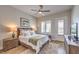 Bedroom furnished with a king-sized bed, nightstands, and a door to the yard at 10537 Shoalhaven Dr, Las Vegas, NV 89134