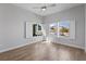 Bright bedroom with stylish wood floors and picturesque views through shuttered windows at 10537 Shoalhaven Dr, Las Vegas, NV 89134