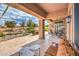 View of the covered patio featuring a seating area and desert landscaping at 10537 Shoalhaven Dr, Las Vegas, NV 89134