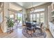 Cozy dining area with seating for four, with access to outdoor dining, and ample natural light at 10537 Shoalhaven Dr, Las Vegas, NV 89134