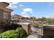 Landscaped front yard features a gate with mountain views in the background at 10537 Shoalhaven Dr, Las Vegas, NV 89134