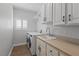 Laundry room including a sink, countertop, washer, dryer and cabinets at 10537 Shoalhaven Dr, Las Vegas, NV 89134