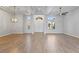 Spacious living room with wood floors, ceiling detail and modern light fixture at 10537 Shoalhaven Dr, Las Vegas, NV 89134
