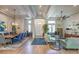 Open concept living room with wood floors, elegant decor and dining area at 10537 Shoalhaven Dr, Las Vegas, NV 89134