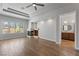 Open living room with hardwood floors, a fireplace, and views of the bathroom at 10537 Shoalhaven Dr, Las Vegas, NV 89134