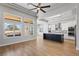Open floor plan with wood floors, kitchen with center island, and lots of natural light at 10537 Shoalhaven Dr, Las Vegas, NV 89134