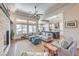 Open concept living room with stone fireplace, modern kitchen and lots of natural light at 10537 Shoalhaven Dr, Las Vegas, NV 89134