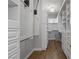 Walk-in closet with custom storage solutions, including shelving, drawers, and hanging rods at 10537 Shoalhaven Dr, Las Vegas, NV 89134