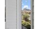 Close-up view of mountain scenery through a shuttered window at 10537 Shoalhaven Dr, Las Vegas, NV 89134