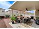 Relaxing covered patio featuring a ceiling fan, outdoor dining, and a barbecue grill at 10657 Medicine Bow St, Las Vegas, NV 89183