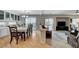 Bright dining room with a long table, chandelier, and easy access to the living area at 10657 Medicine Bow St, Las Vegas, NV 89183