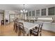 Bright dining room with a long table, chandelier, and easy access to the kitchen at 10657 Medicine Bow St, Las Vegas, NV 89183