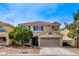 Charming two-story home with a well-maintained front yard and desert landscaping at 10657 Medicine Bow St, Las Vegas, NV 89183