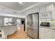 Bright kitchen features white cabinets and stainless steel refrigerator at 10657 Medicine Bow St, Las Vegas, NV 89183