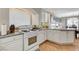 Bright kitchen featuring white cabinets, granite countertops, and stainless steel appliances at 10657 Medicine Bow St, Las Vegas, NV 89183