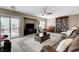 Inviting living room with plush seating, piano, bookcase, and backyard access at 10657 Medicine Bow St, Las Vegas, NV 89183
